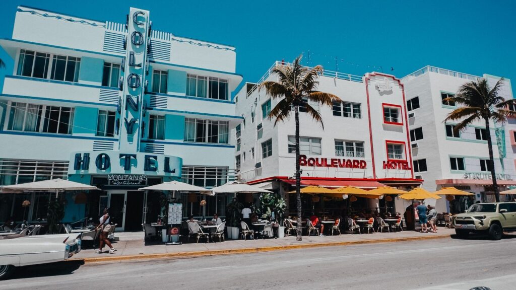 Pastel Art Deco hotels and palm trees along Ocean Drive in South Beach, Miami